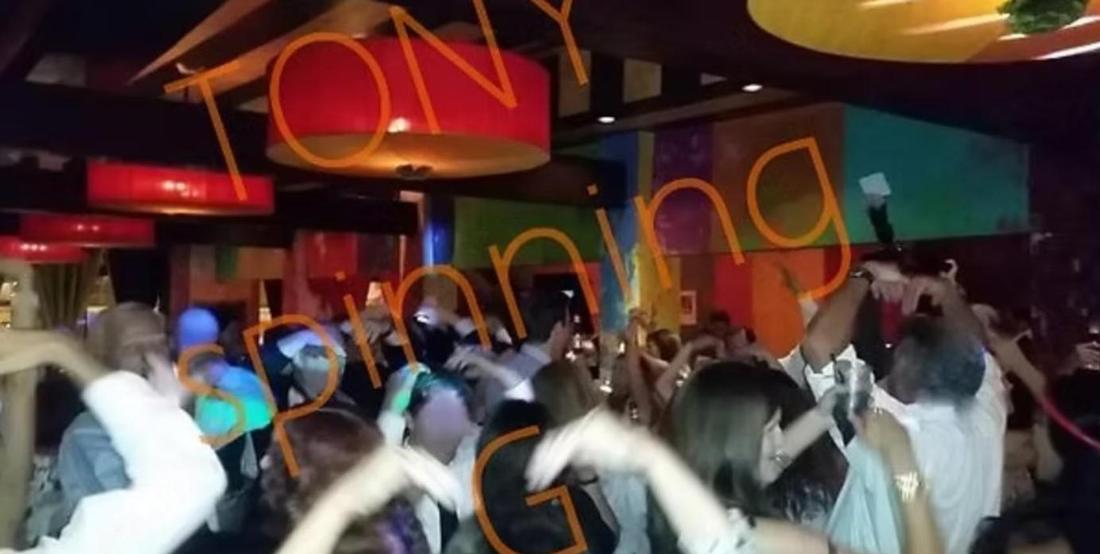 Crowd with hands up in a nightclub